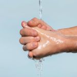 sideways-person-washing-hands-isolated-blue