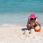 cute-asian-child-girl-having-fun-play-with-sand-beach-summer-vacation-7186-2465-26_58_343512